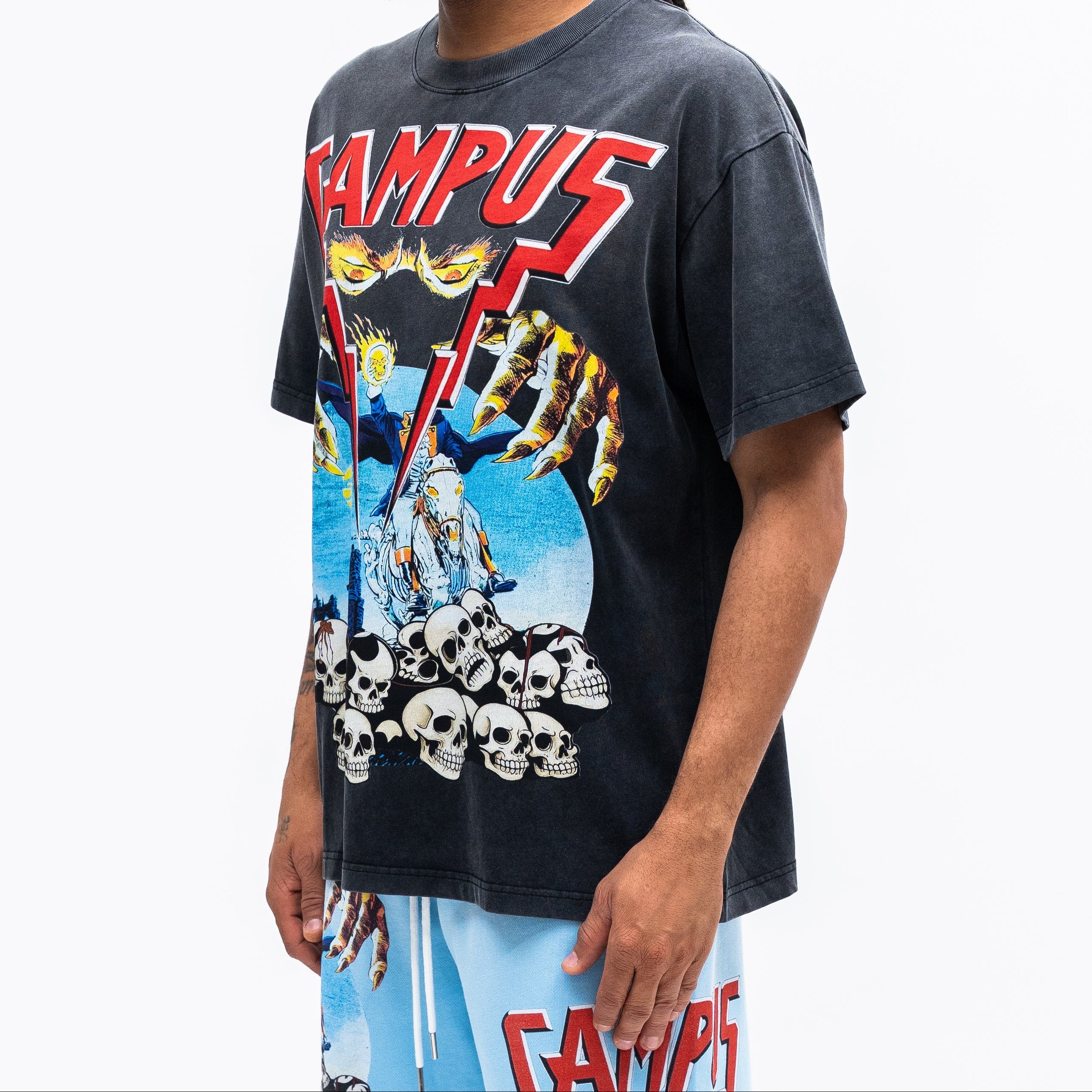 Person wearing a graphic t-shirt with 'CAMPUS' text and design on a white background