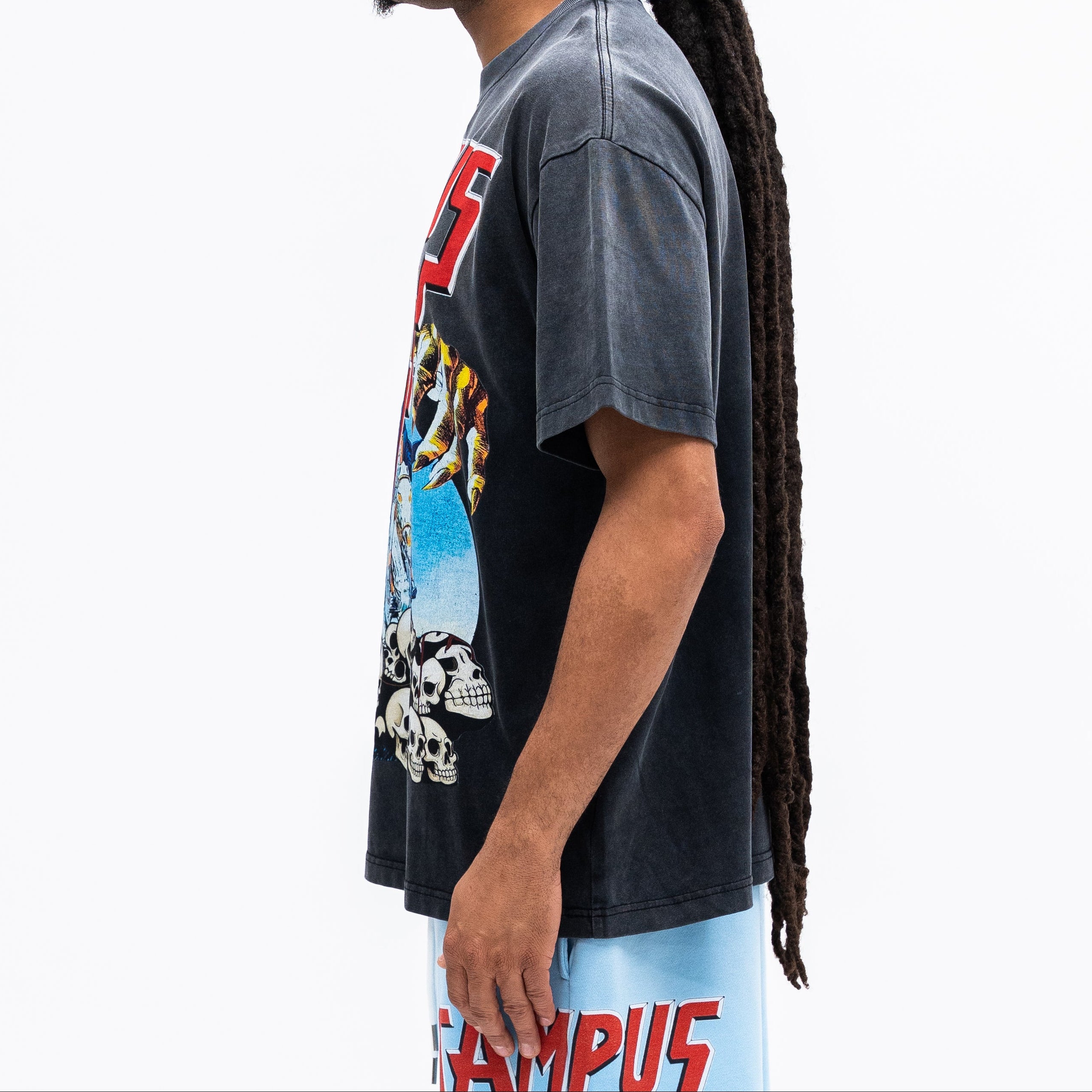 Person wearing a black t-shirt with colorful graphics on a white background