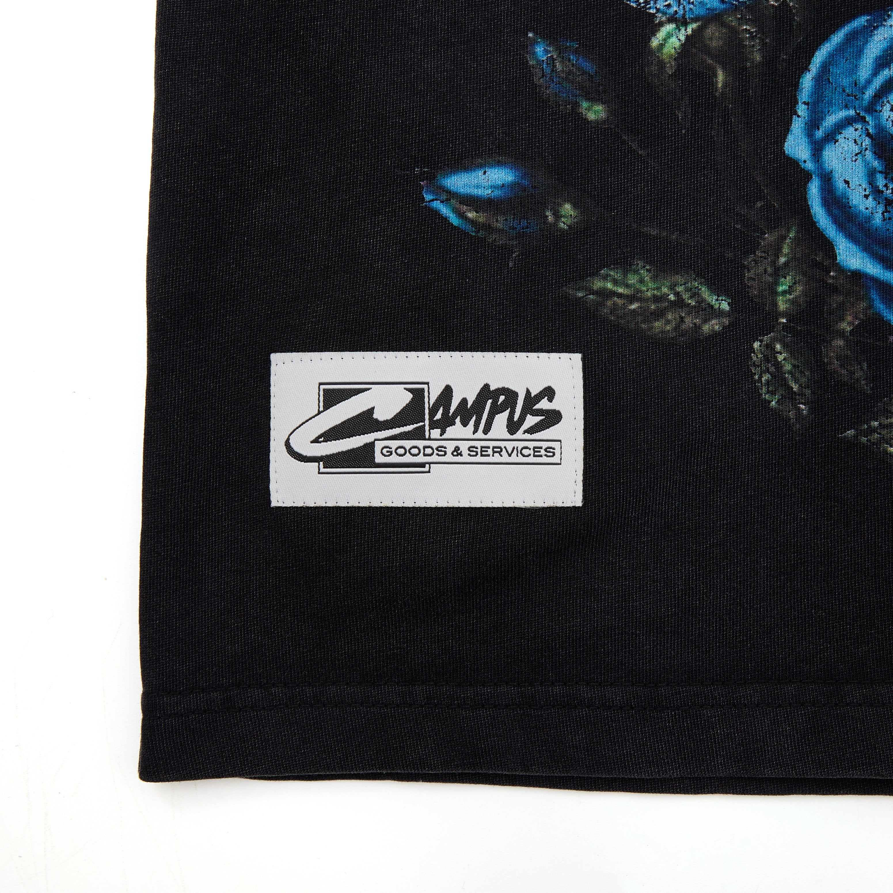 Black garment with a visible label featuring 'CAMPUS GOODS & SERVICES' on a white background