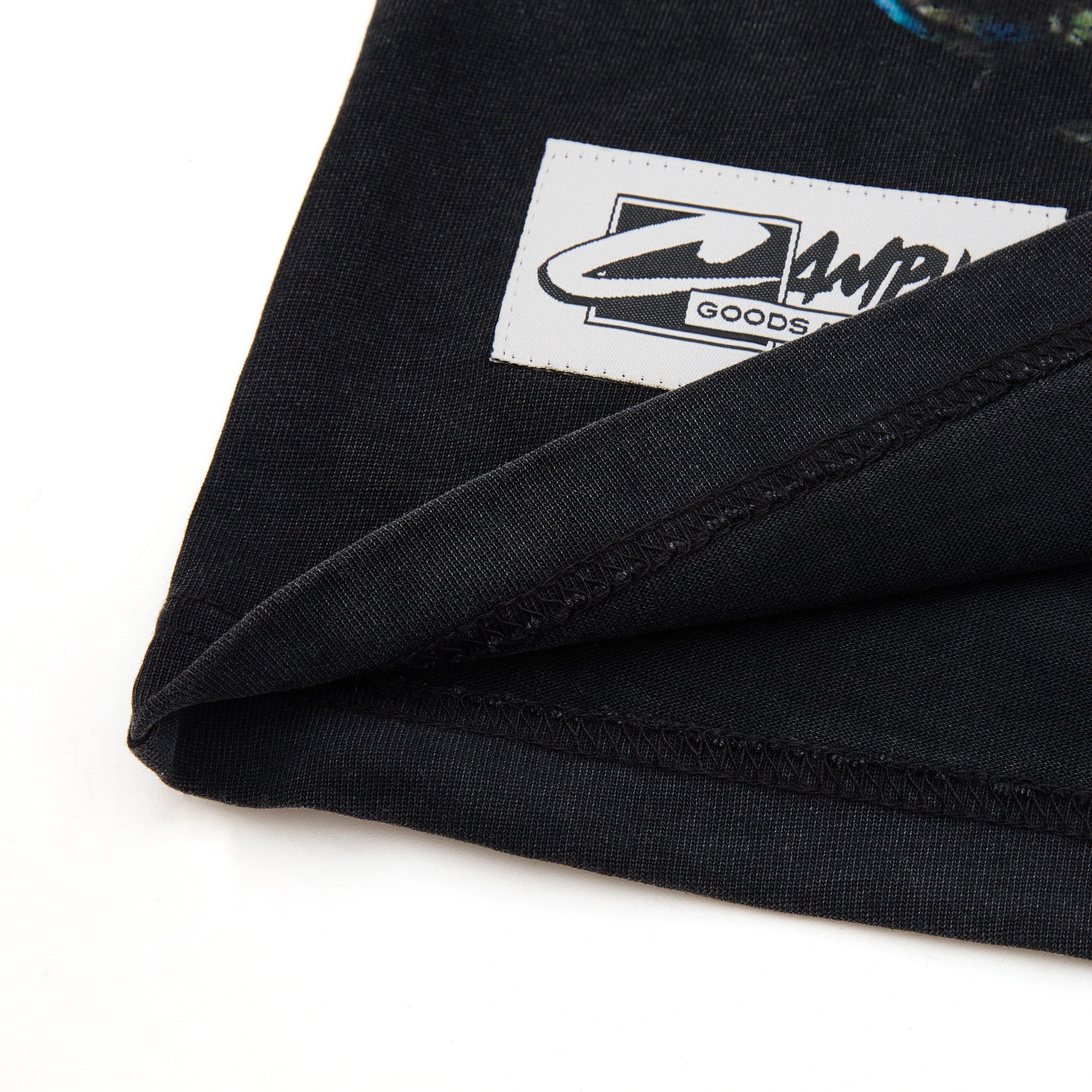Black fabric with a visible brand logo on a white background