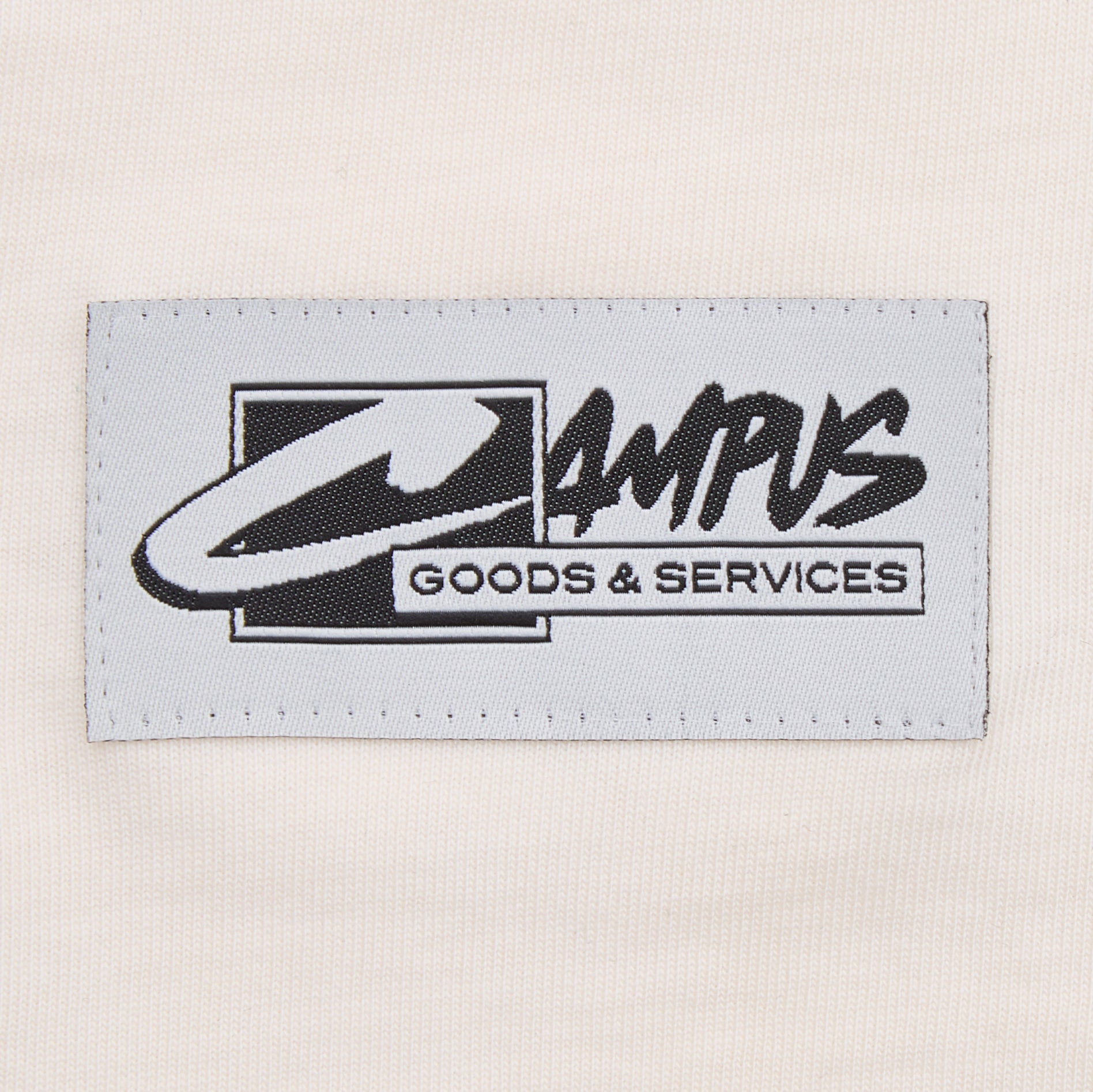 Label with 'Campus Goods & Services' text on a beige background