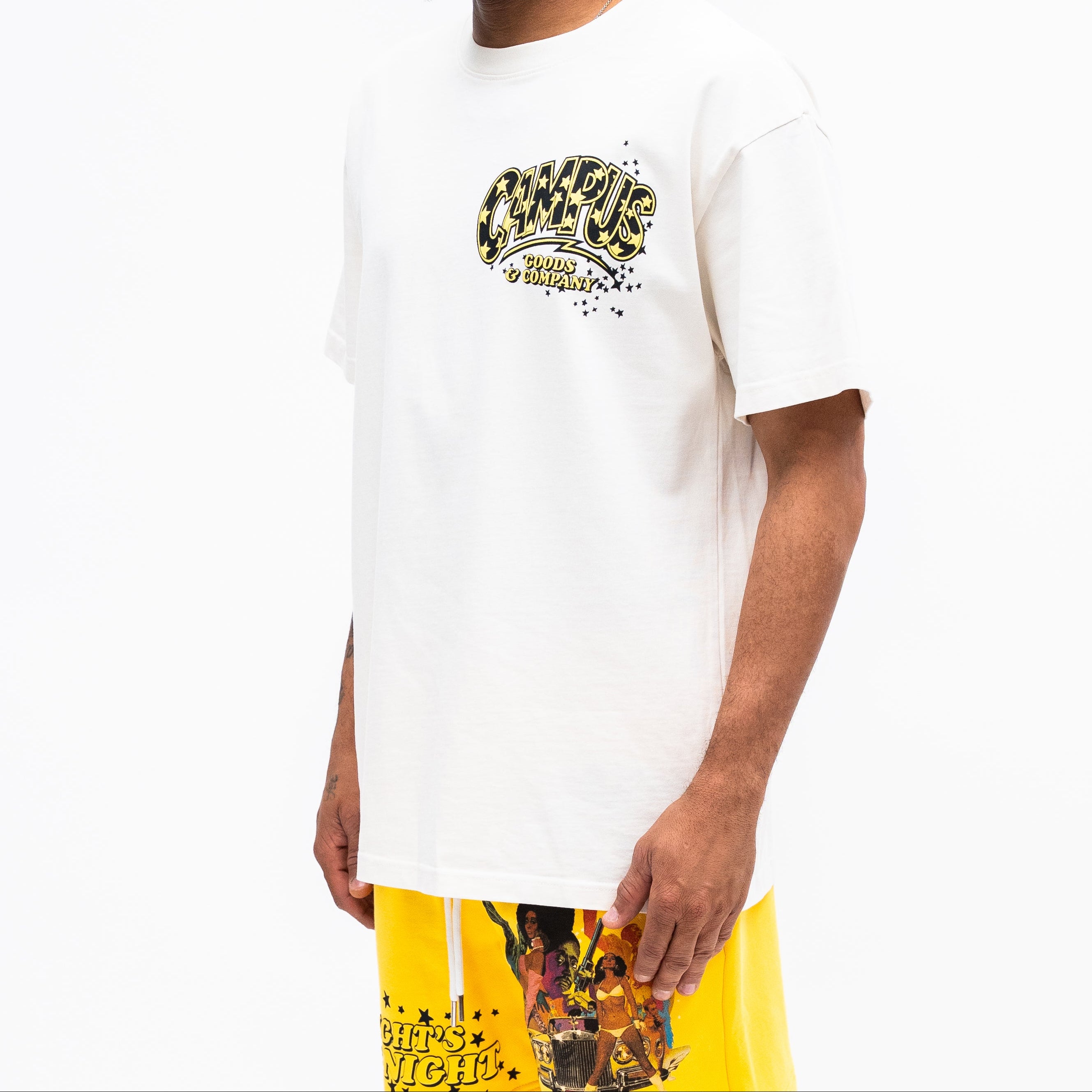 Man wearing a white t-shirt with a graphic design on a white background