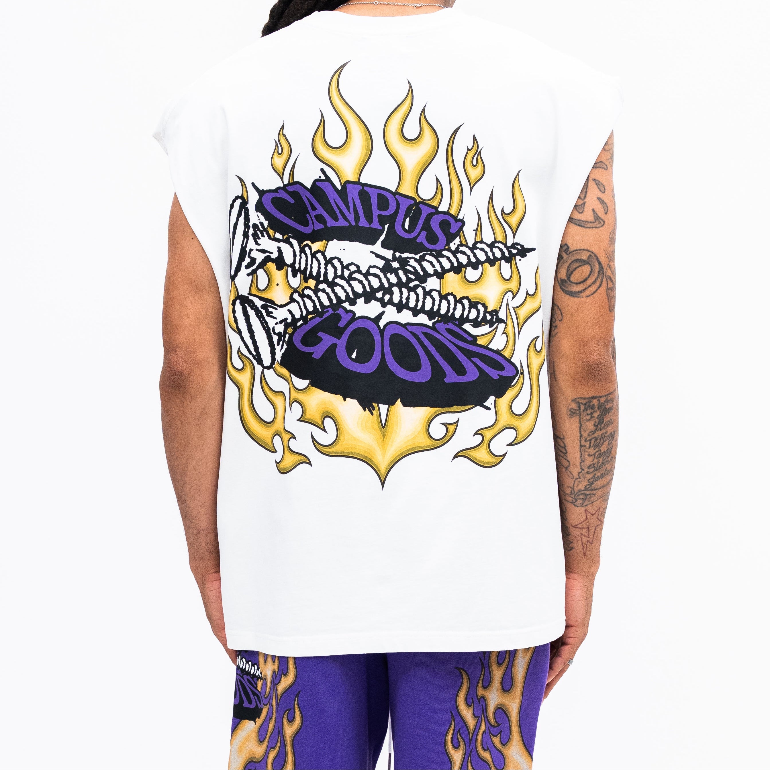 Person wearing a sleeveless shirt with 'Campus Goods' design on a white background
