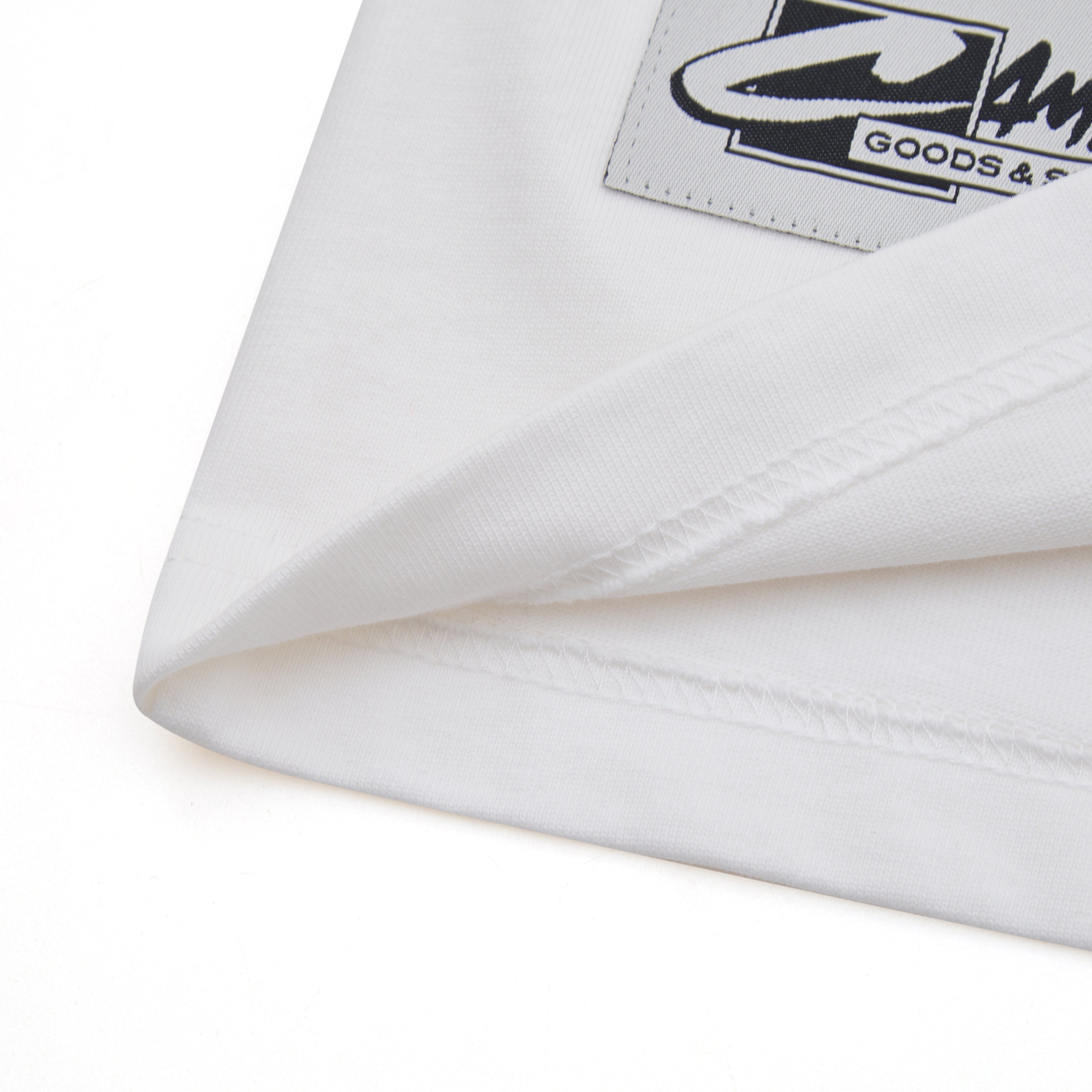 White tee with the CAMPUS GOODS logo on a white background