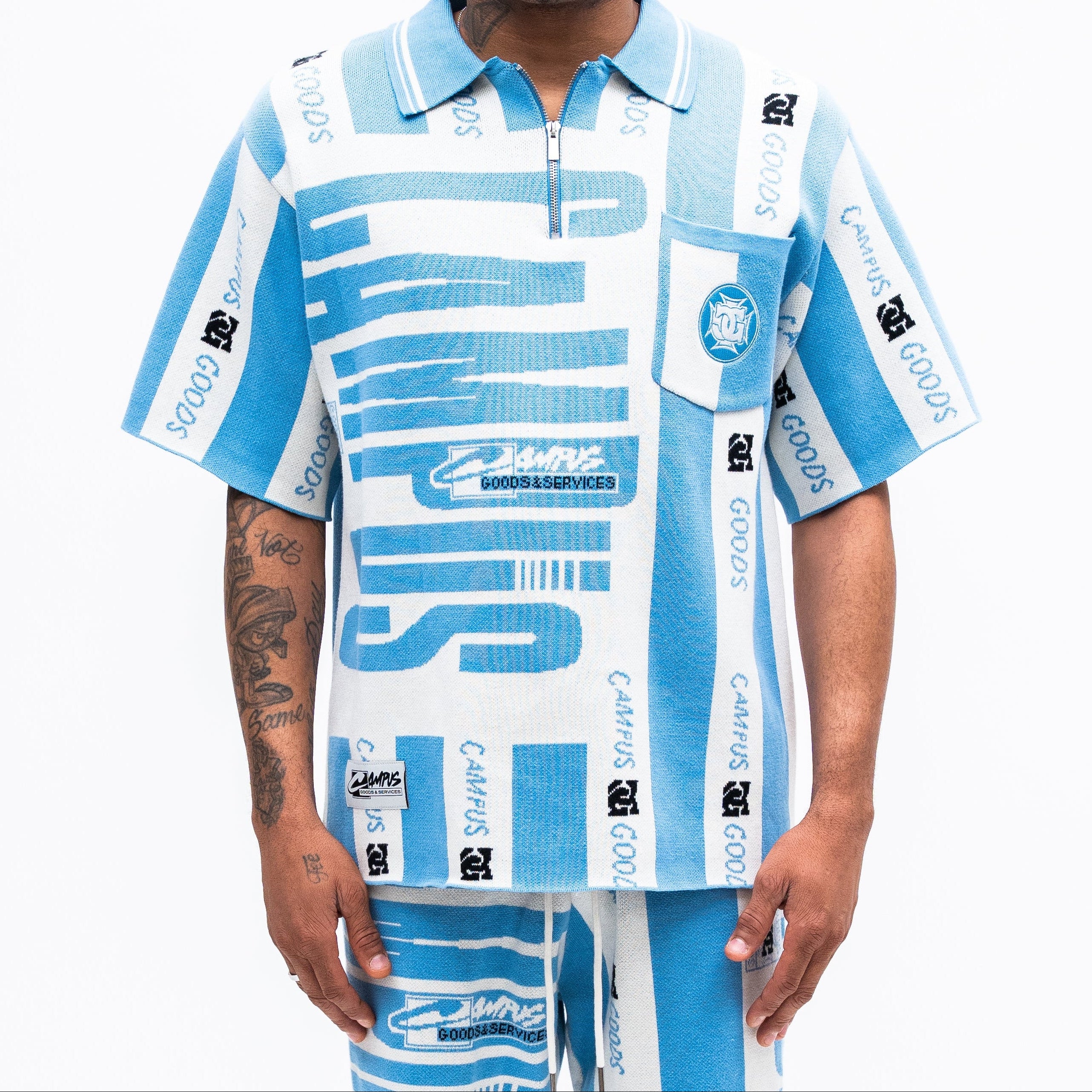 Person wearing a CAMPUS GOODS blue and white patterned outfit on a white background