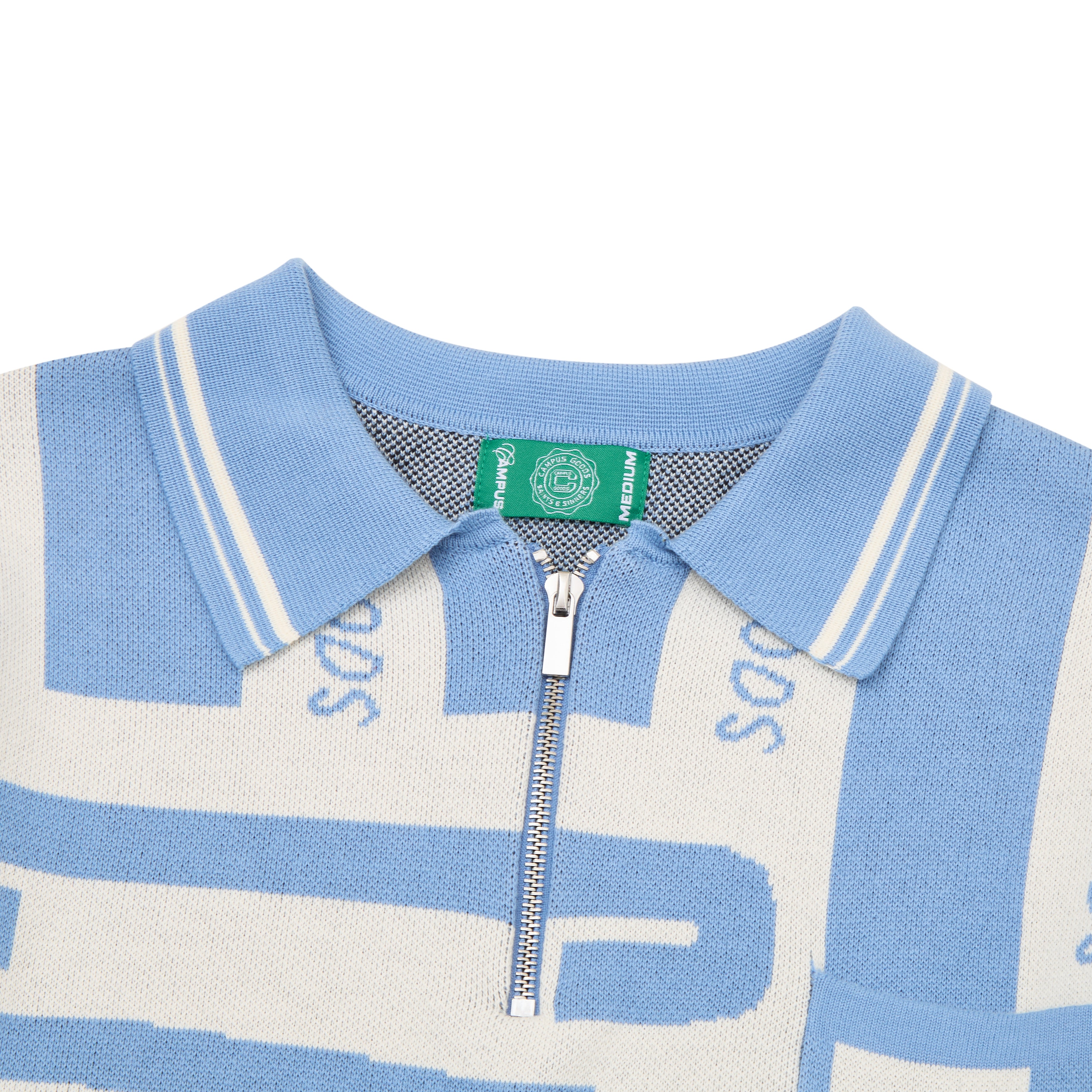 Close-up of a blue and white patterned sweater with a zipper on a white background