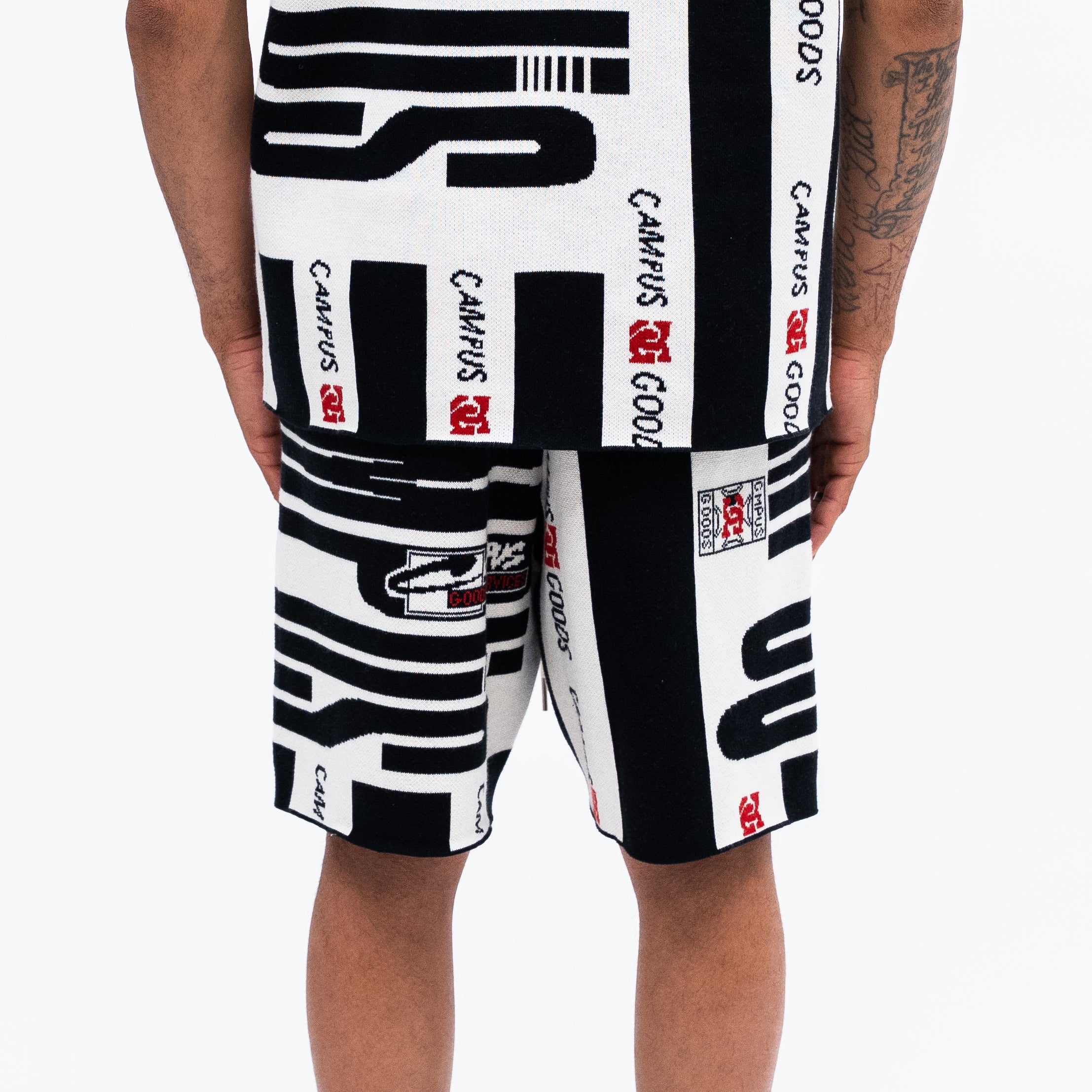 Black and white shorts with CAMPUS GOODS branding on a white background