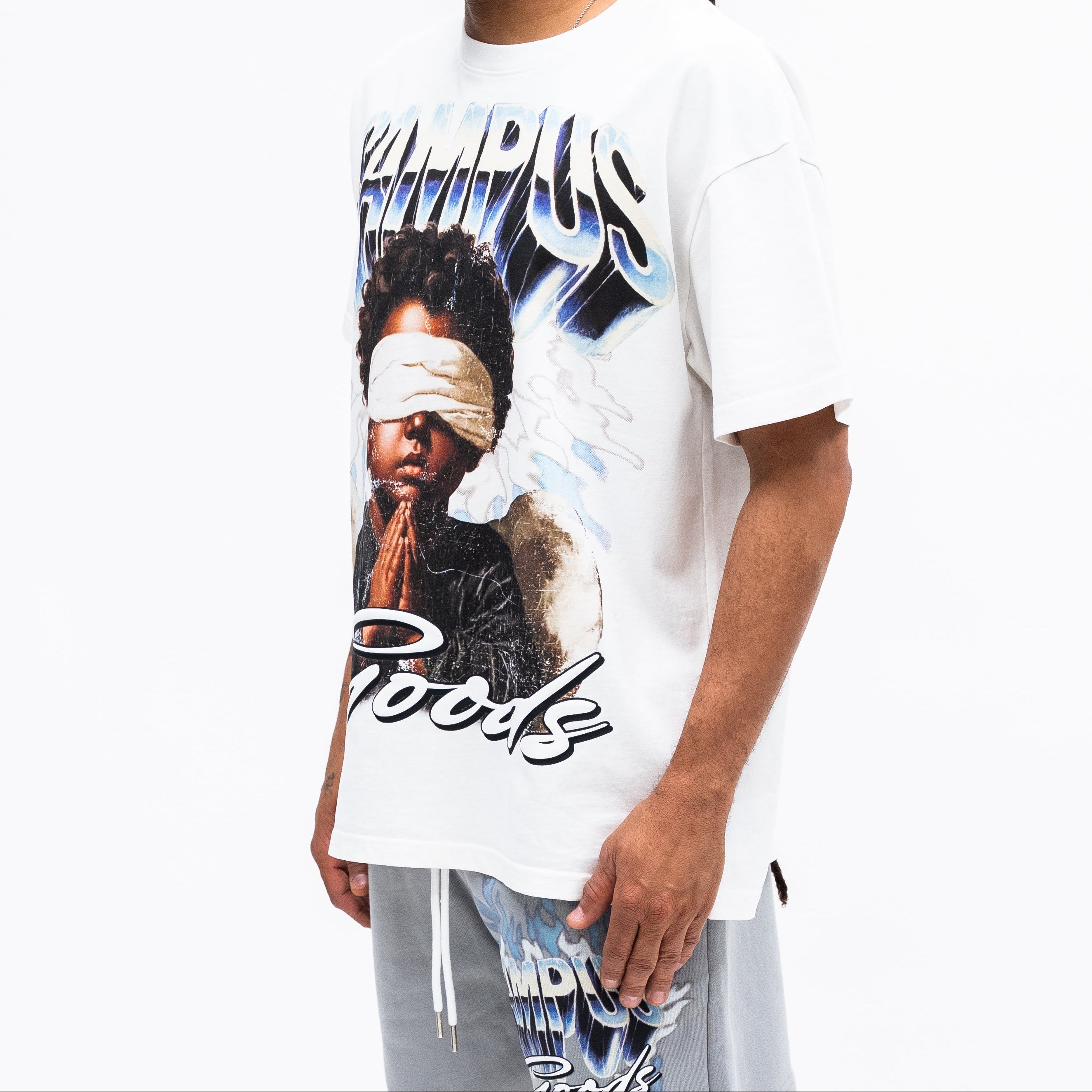Person wearing a white t-shirt with graphic design on a white background