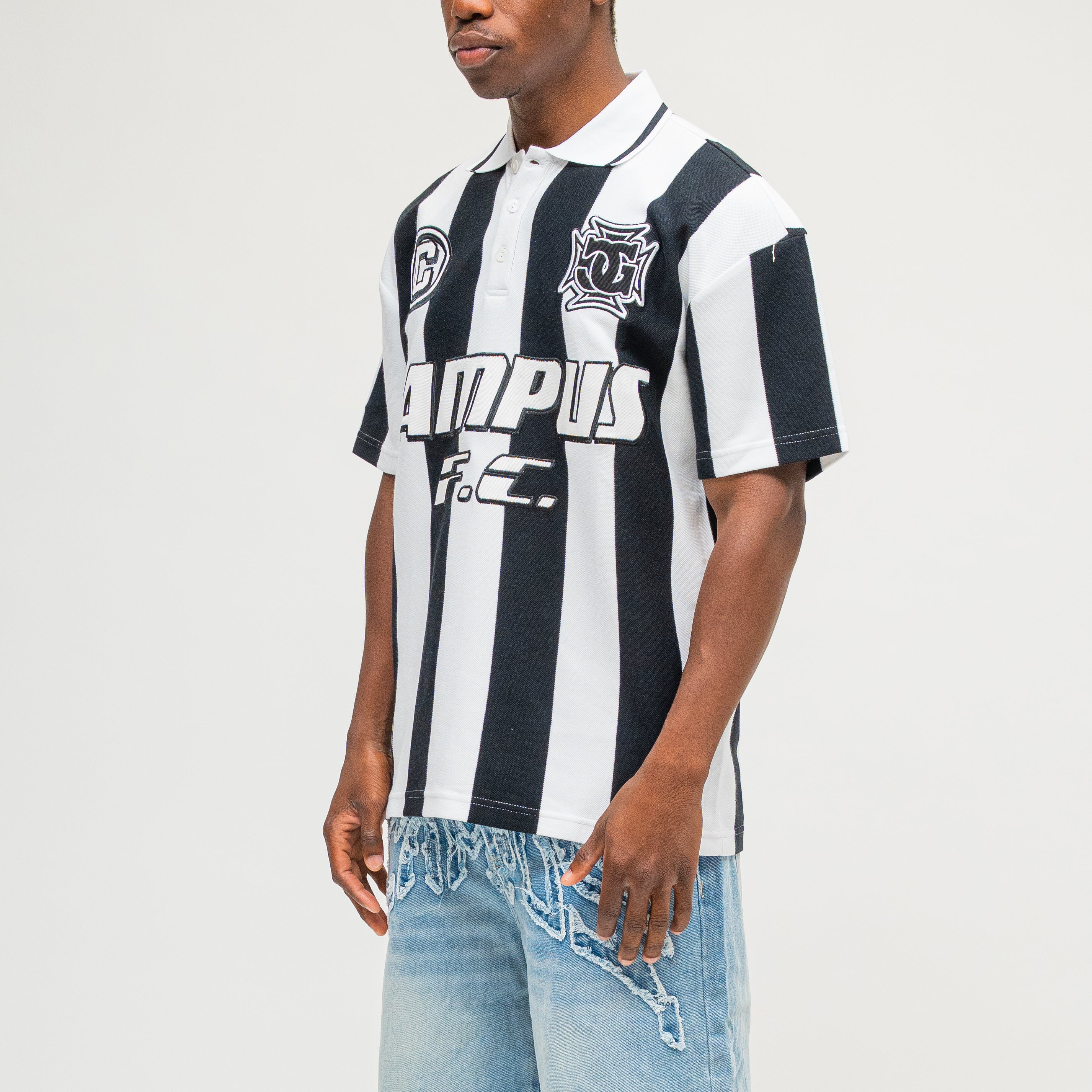 CAMPUS GOODS LA Striped SS Polo in Black, three-quarter front view